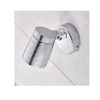 Polished chrome bathroom spotlight mounted on white ceiling with water droplets covering the fixture, demonstrating IP44 wate