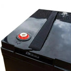 Black gel battery with red cap and threaded terminal, shown at an angle displaying the top surface and side profile.