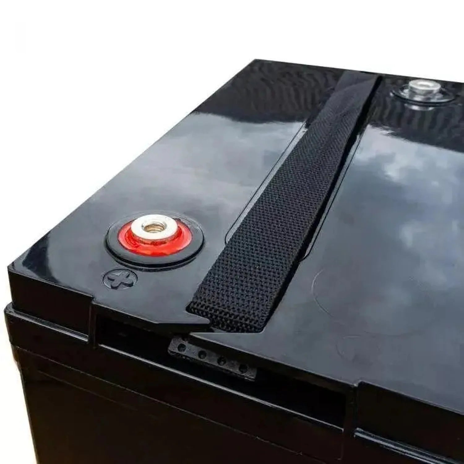 Black gel battery with red cap and threaded terminal, shown at an angle displaying the top surface and side profile.