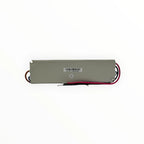 Linear LED strip driver with gray metal housing, red and black wires, serial number label, and QC passed sticker visible.