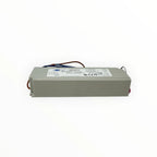 White rectangular LED driver with blue and brown wires, CE and FCC certification marks visible on label.