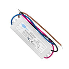 White rectangular LED strip driver with colored wire leads, product specifications label visible, shown at an angle against w