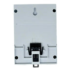 White modular circuit breaker panel with gray toggle switch, black central mechanism, and mounting holes visible in this fron