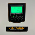 Voltacon Energy Systems solar inverter control display panel with green LCD screen showing input and output readings, functio