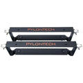 Two black Pylontech mounting brackets stacked vertically, each with metal corner brackets and rubber padding for battery inst