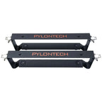 Two black Pylontech mounting brackets stacked vertically, each with metal corner brackets and rubber padding for battery inst
