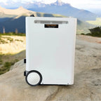 Voltacon Energy Systems portable power station displayed outdoors against mountain landscape backdrop.