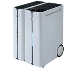 White portable power station with dual black tops and control panel, featuring wheels and battery status indicator strip.