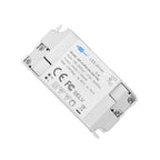 White LED driver power supply unit with screw terminals, CE marking visible, specifications label shown on front face.