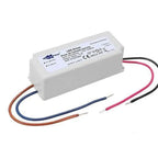 White LED driver with label, four colored output wires extending from bottom left and right sides.