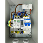 Interior view of AC combiner box showing circuit breakers, surge protection modules, and color-coded wiring connections mount