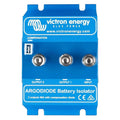 Victron Energy blue battery isolator with three silver terminals labeled Input, Output 1, and Output 2, featuring compensatio