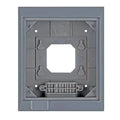 Gray wall-mounted enclosure backplate with central opening, mounting brackets, and cable grommet at bottom.