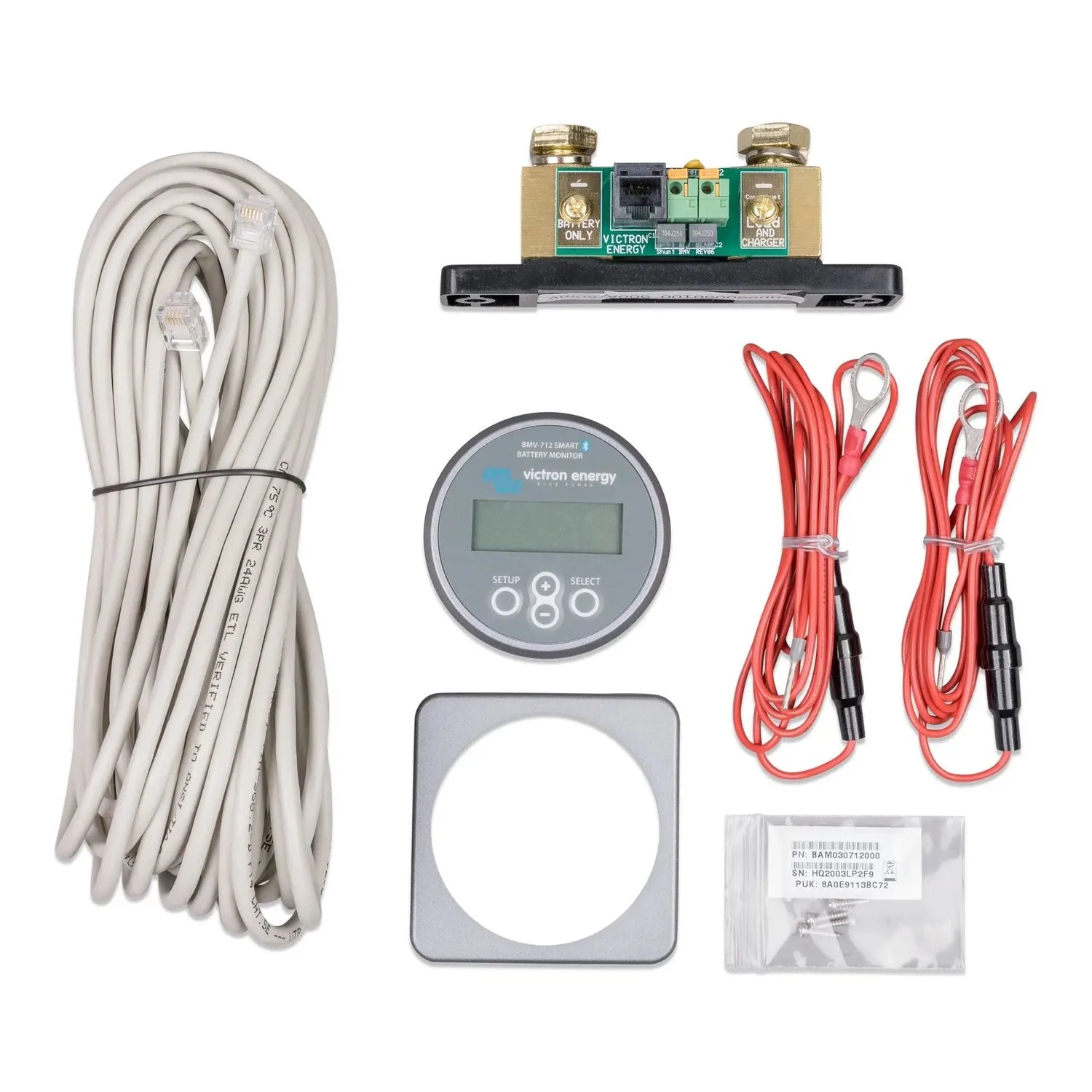Victron BMV-712 battery monitor kit components laid out: display unit, shunt, cables, connectors, and installation hardware.