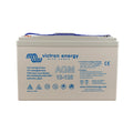 Victron Energy AGM 12-125 rechargeable battery with blue terminals and instruction labels on cream-colored case.