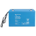 Victron Energy blue lithium battery 12.8V 100Ah with attached black cables and safety certification symbols on front panel.