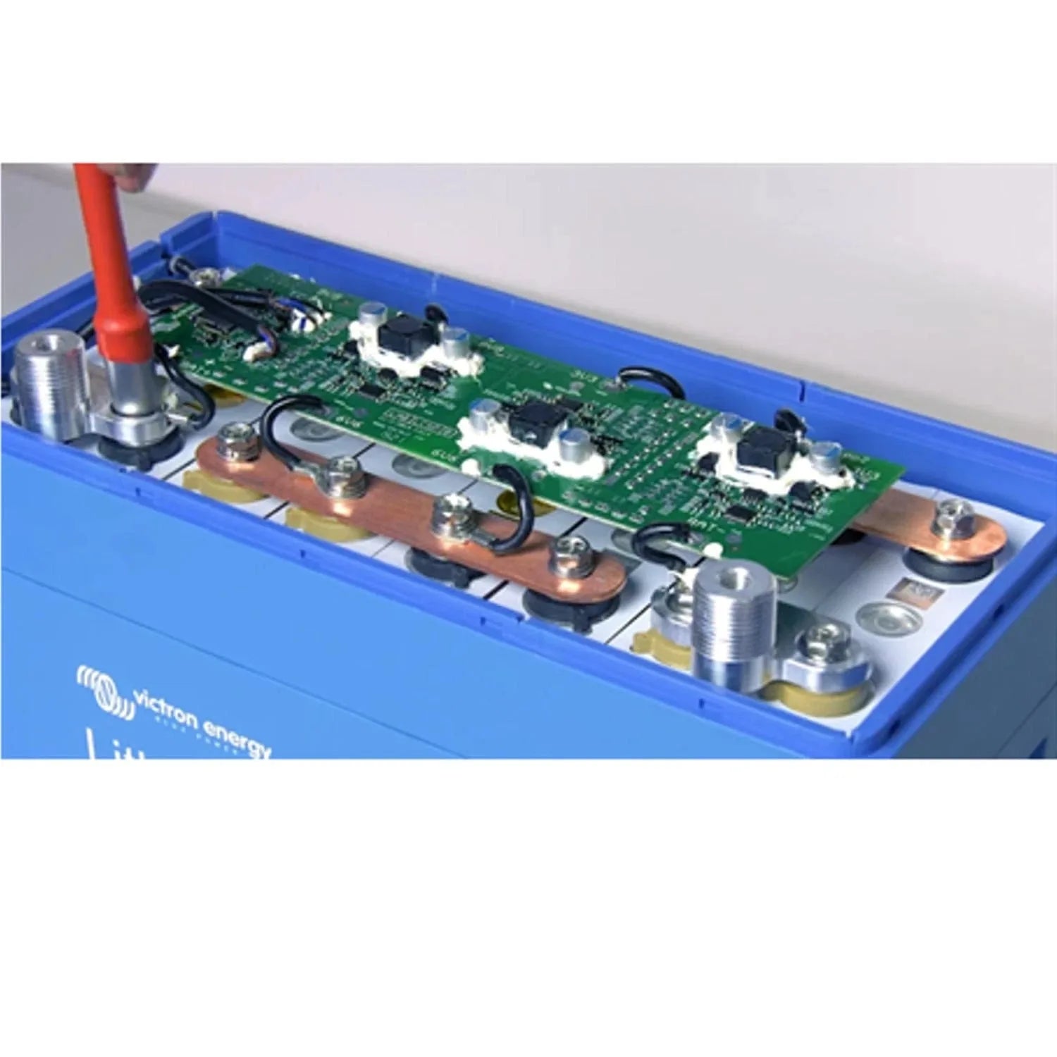 Victron LiFePO4 battery interior showing green circuit board with black components and copper bus bars in blue casing.