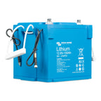 Victron Energy Lithium 12.8V-150Ah blue battery with attached black and white cables against white background.