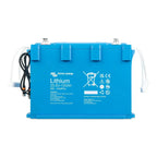 Victron Lithium 25.6V-100Ah NG LiFePO4 battery, bright blue rectangular unit with white cables and top-mounted terminals.