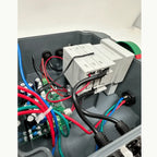 BFS-S2 rapid shutdown switch installed in electrical enclosure with red, blue, and green wiring connected to circuit board an