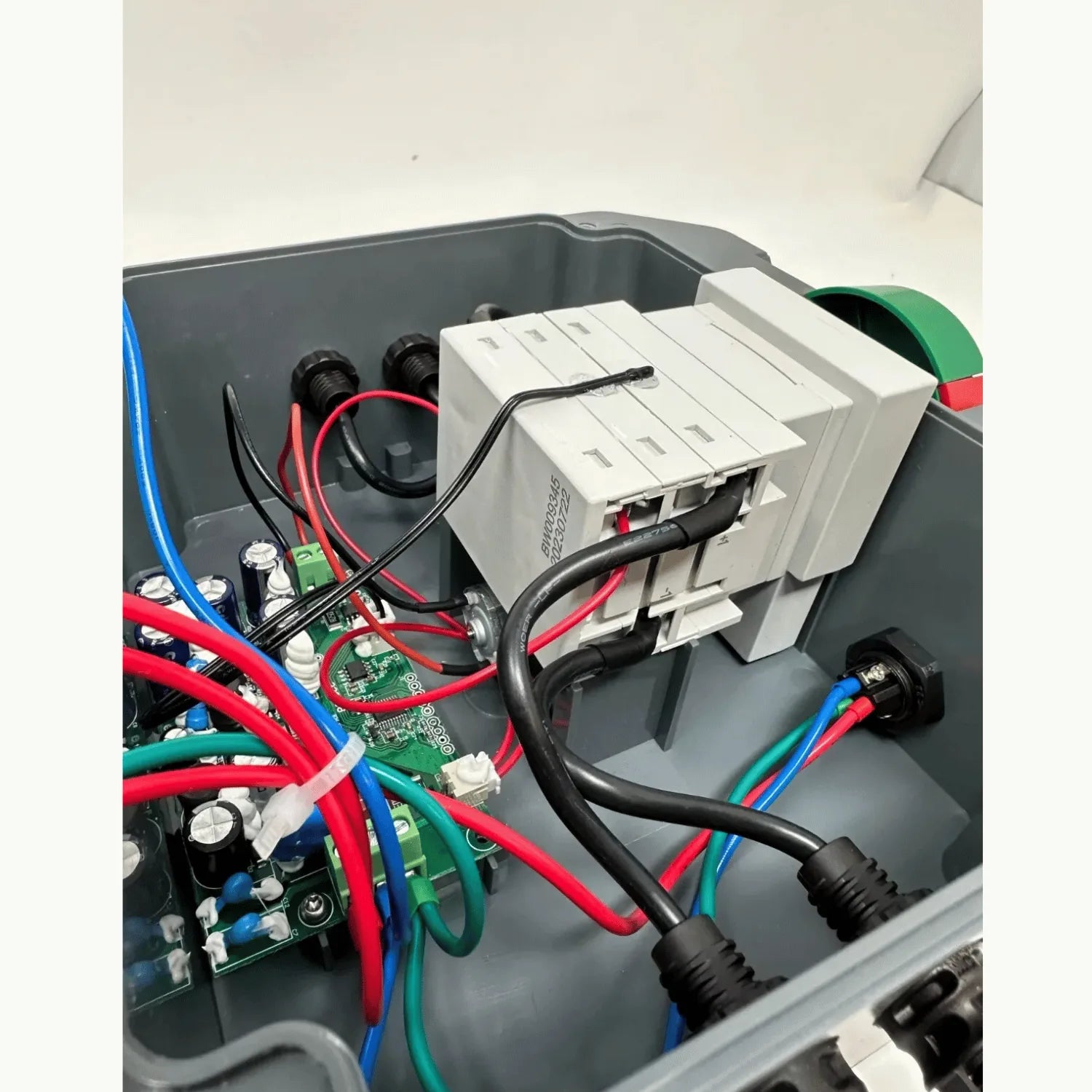 Installation shot of BFS-S3 rapid shutdown switch showing white disconnect modules, colored wiring, and green circuit board m