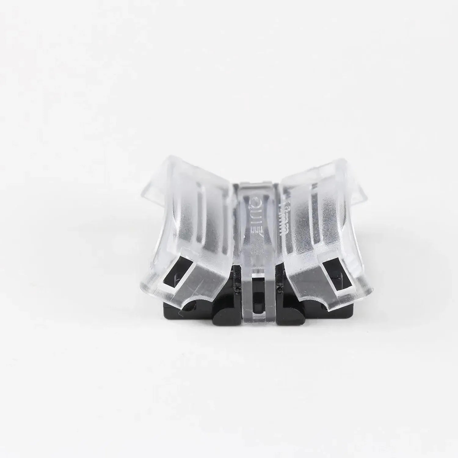 Transparent LED strip connector with black base and multiple pins, shown against white background.