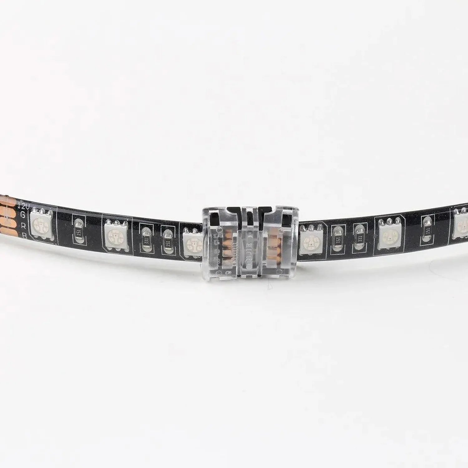 LED strip connector board showing transparent housing with copper contacts connecting two black circuit strips on white backg