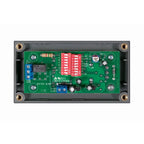 Victron Battery Alarm circuit board showing green PCB with red DIP switches, blue terminal blocks, and gold mounting posts in