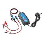 Victron Blue Smart 12V charger with attached cables, alligator clips, ring terminals, and UK power cord displayed on white ba