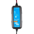 Victron Blue Smart 12V 7A waterproof battery charger with blue faceplate showing LED indicators and mode button, black power 