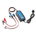 Victron Blue Smart 12V battery charger with clamp connectors, ring terminals, multiple charging cables, and power cord displa