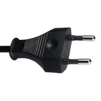 Black two-pin European power plug with coiled cable against white background.