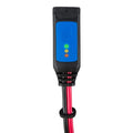 Victron battery indicator with blue display showing three colored status lights, black housing, and red cable with eyelet con