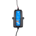 Victron Blue Smart IP65 waterproof 12V/15A charger with wall mounting brackets and power cable against white background.