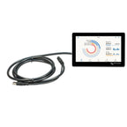 Victron GX Touch 70 display with coiled black USB cable, showing real-time energy monitoring dashboard with battery, generato