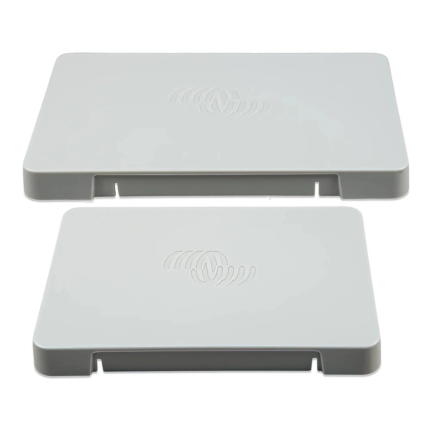 Two white rectangular protective covers with wireless symbol embossed on top, shown stacked vertically with mounting tabs vis