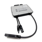 Voltacon VMI600 solar microinverter with aluminum faceplate, black heatsink fins, and attached MC4 connector cables on white 