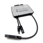 600W grid-tied solar microinverter with white faceplate, black aluminum housing, and two MC4 connectors with attached cable.