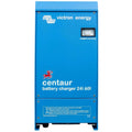 Victron Energy Centaur 24/60 battery charger, blue metal enclosure with analog ammeter display and safety warnings label.