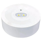 White round emergency light fixture with two yellow LED lights mounted on ceiling or wall.