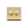 Two-gang brass dimmer switch with chrome knobs and white trim ring on white background.