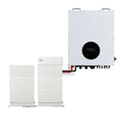 Voltacon Energy Cube 30kW hybrid inverter with black display panel mounted on white wall, connected to two white lithium batt