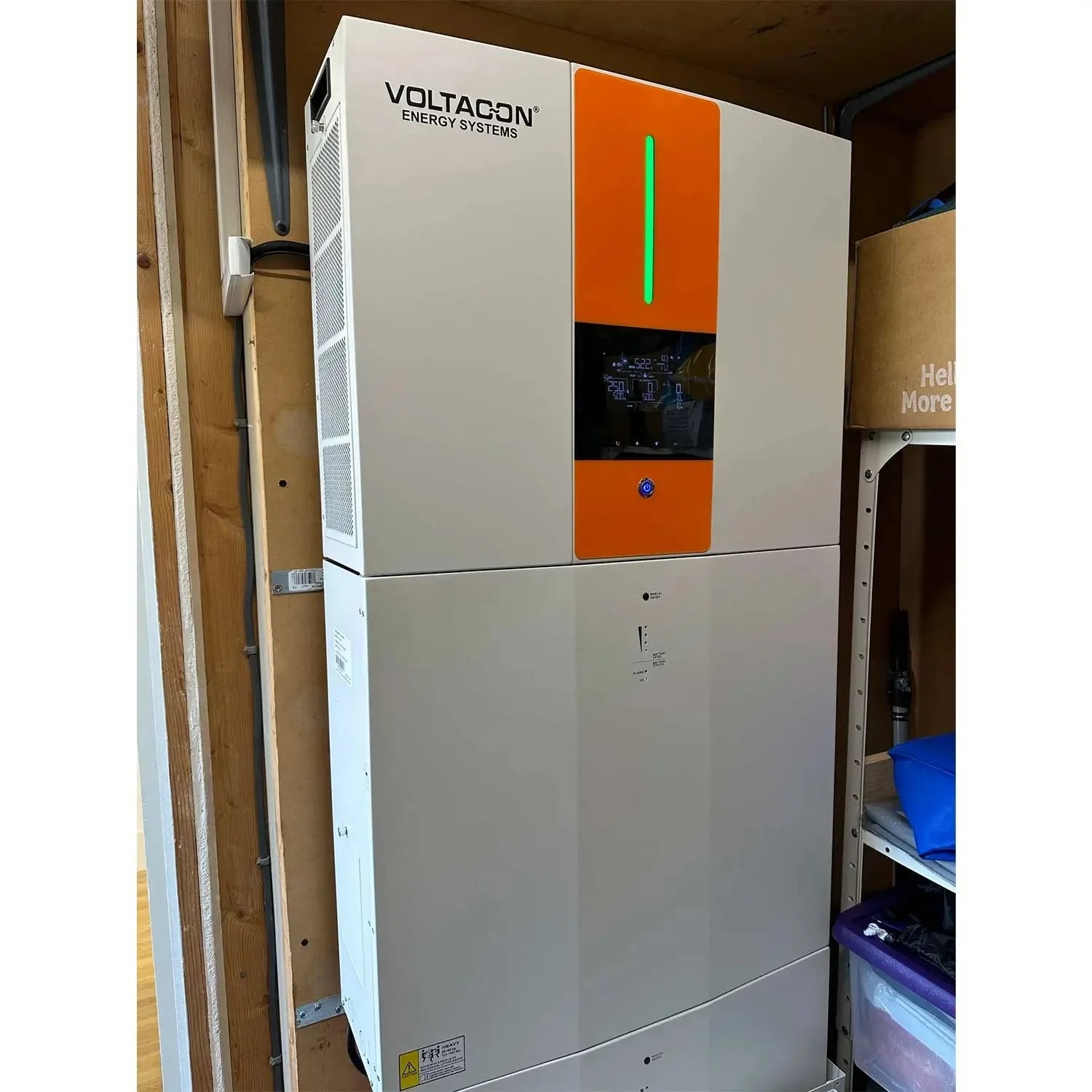 Voltagon Energy Systems 5.5kW all-in-one home battery storage unit installed in residential setting, white casing with orange