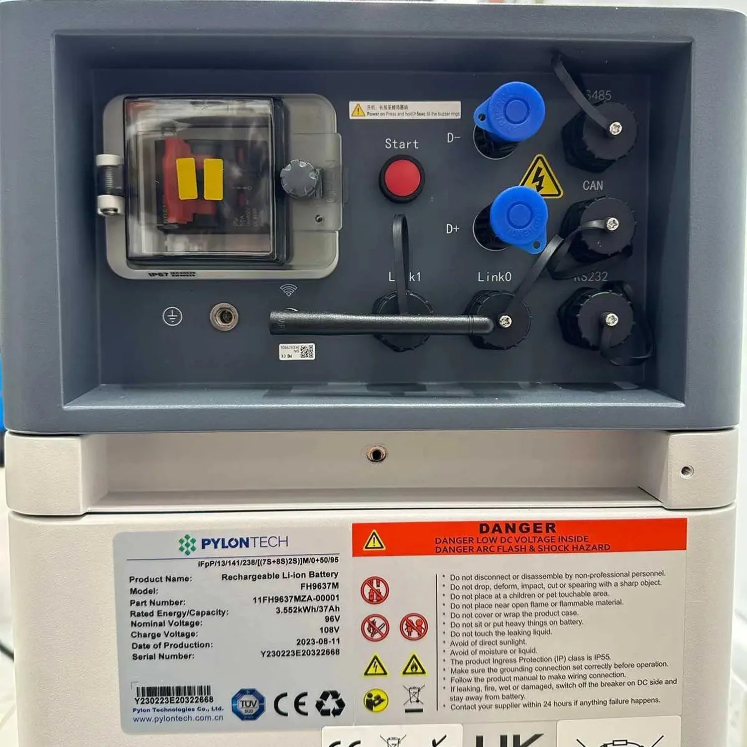 Pylontech lithium battery management system controller with red start button, blue safety switches, antenna, and warning labe