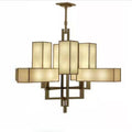 Dellamont 8-way LED ceiling pendant with bronze metal frame and cream fabric shades arranged in geometric pattern.