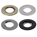 Four recessed downlight trim rings in brass, chrome, and black finishes shown against white background.