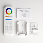 Miboxer Mi-Light remote control with color wheel, brightness slider, and preset buttons, displayed with user manual and mount