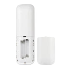 White remote control shown disassembled with battery compartment open, displaying interior mechanisms and batteries.