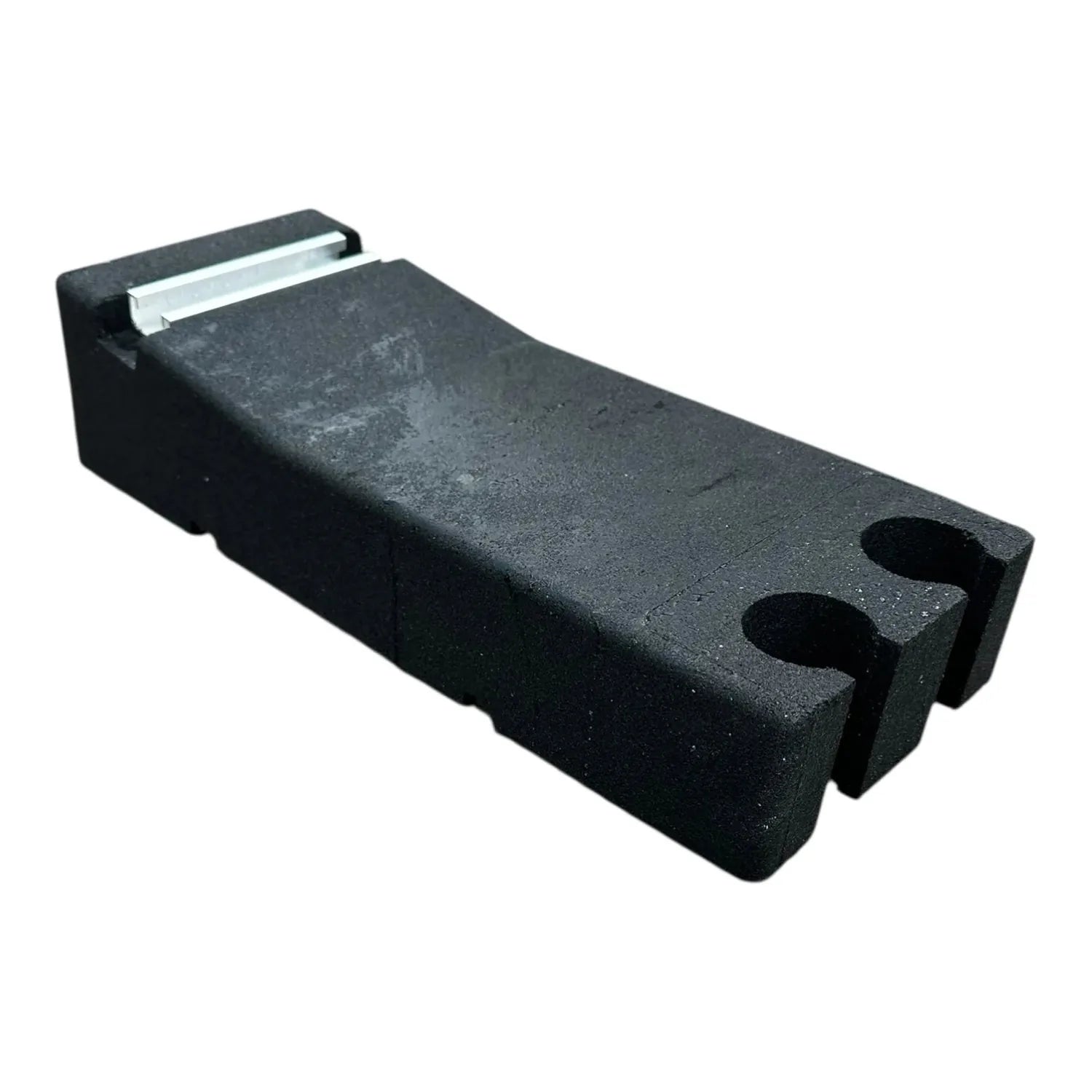 Black rubber ballast block with two circular cutouts and integrated mini rail system, shown against white background.