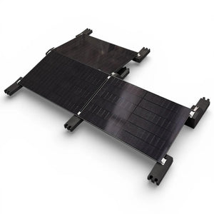 Black solar panel mounting system with multiple panels connected by hinges and supported by four corner brackets on white bac